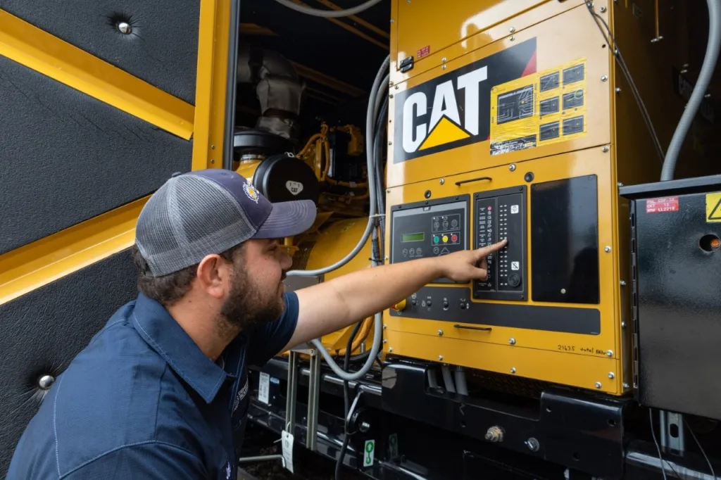 Generator Source technician working on cat generator