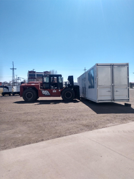 Case Study – Engineering a 1000kW Custom-Contained Power Module 1 generator source moving an industrial generator