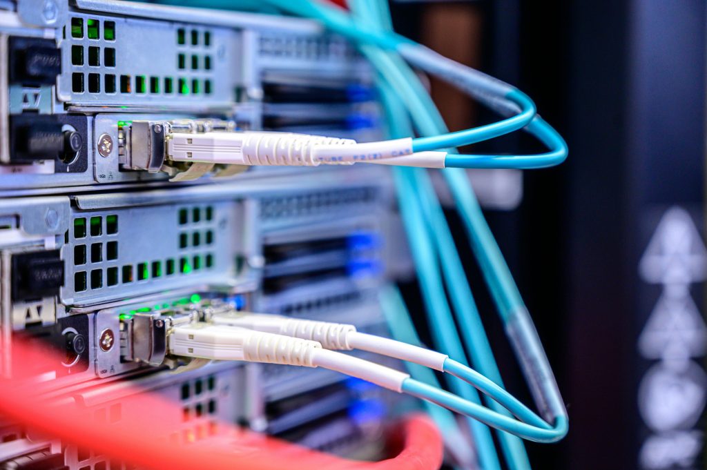 Paralleling Switchgear Explained: How We Power Hyperscale Data Center Growth 2 Fiber optic network connections on an active data center switch