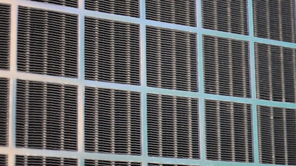 Radiator being cleaned with low pressure water spray