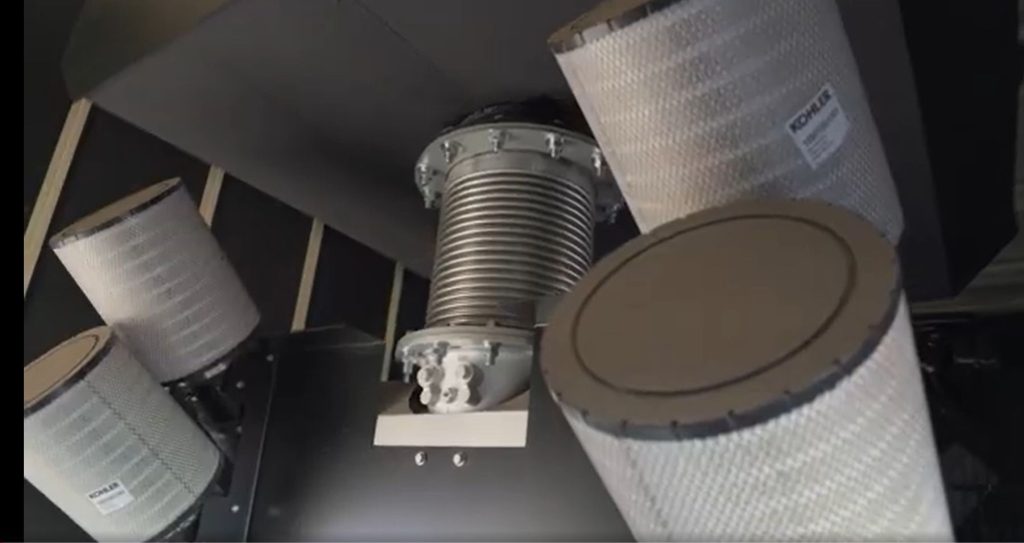 Four industrial air filters being serviced during a PM1 inspection. Regular filter replacement prevents debris contamination and maintains optimal engine airflow.