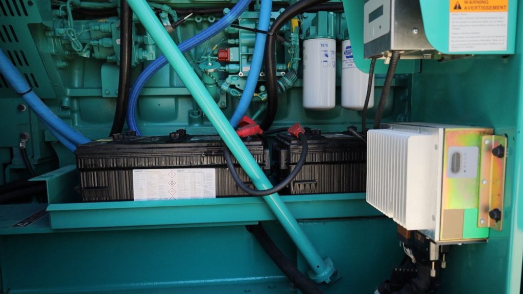 Generator batteries being inspected for cranking capacity